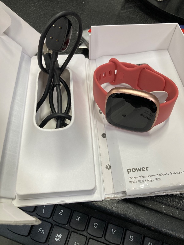 Photo 1 of ***DOES NOT POWER ON***Fitbit Versa 4 Fitness Smartwatch with Daily Readiness, GPS, 24/7 Heart Rate, 40+ Exercise Modes, Sleep Tracking and more, Pink Sand/Copper Rose, One Size (S & L Bands Included)***DOES NOT POWER ON***