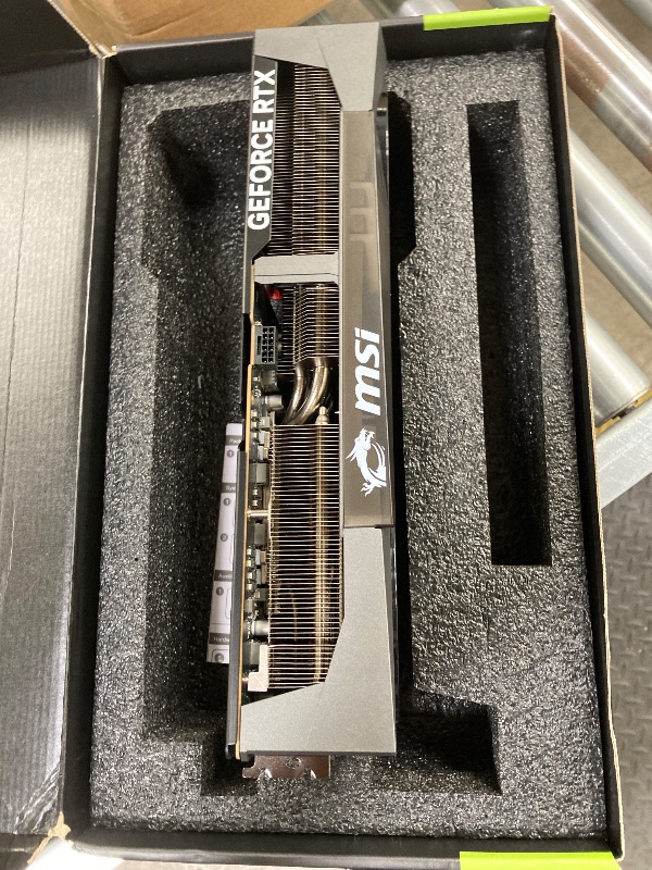 Photo 1 of , NON FUNCTIONAL, WARRANTY VOIDED  ------- msi Gaming RTX 5090 32G Gaming Trio OC Graphics Card (32GB GDDR7, 512-bit, Extreme Performance: 2497 MHz, DisplayPort x3 2.1a, HDMI 2.1b, NVIDIA Blackwell Architecture)