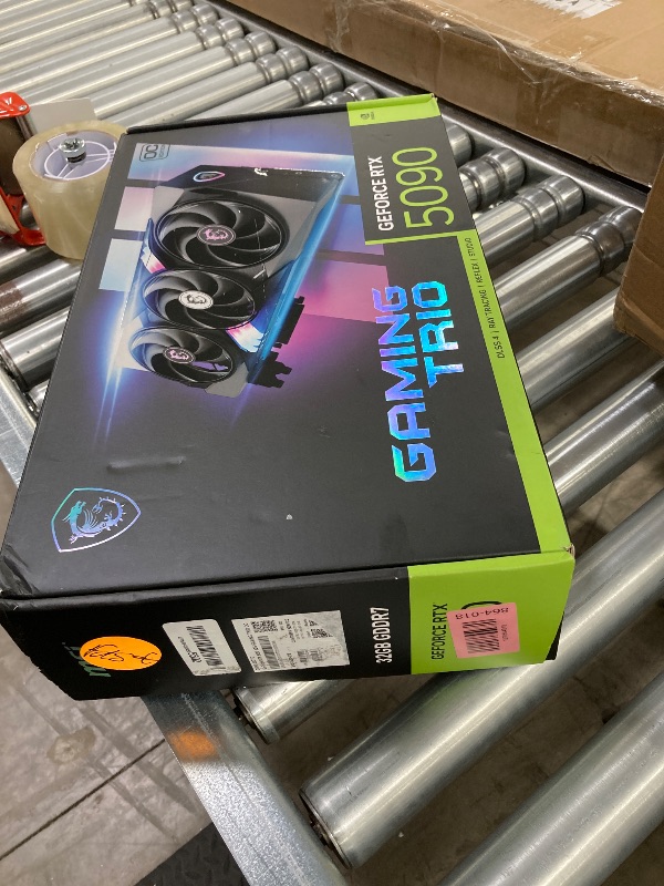 Photo 1 of , NON FUNCTIONAL, WARRANTY VOIDED  ------- msi Gaming RTX 5090 32G Gaming Trio OC Graphics Card (32GB GDDR7, 512-bit, Extreme Performance: 2497 MHz, DisplayPort x3 2.1a, HDMI 2.1b, NVIDIA Blackwell Architecture)
