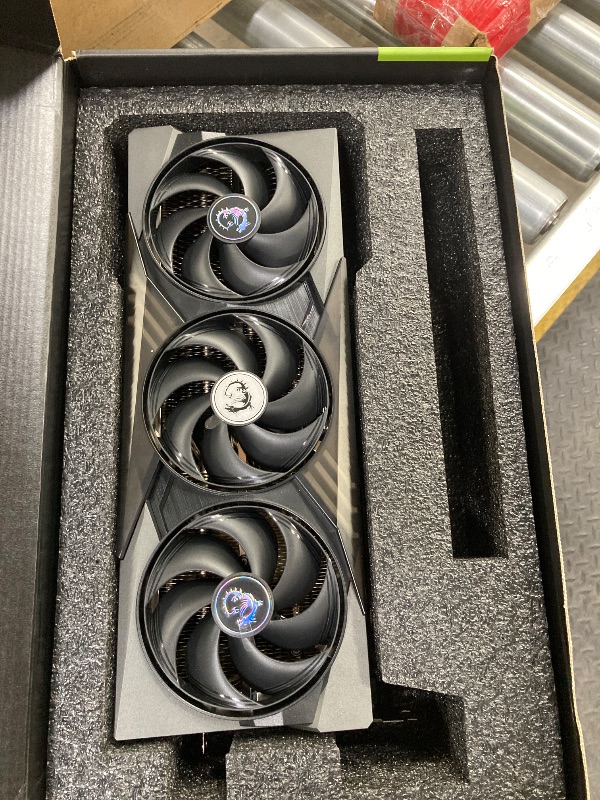 Photo 1 of , NON FUNCTIONAL, WARRANTY VOIDED  ------- msi Gaming RTX 5090 32G Gaming Trio OC Graphics Card (32GB GDDR7, 512-bit, Extreme Performance: 2497 MHz, DisplayPort x3 2.1a, HDMI 2.1b, NVIDIA Blackwell Architecture)