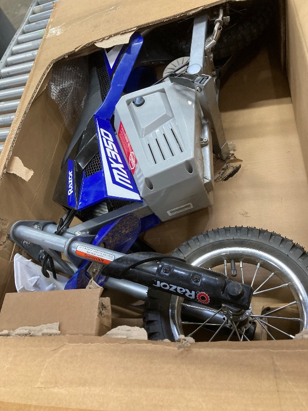 Photo 1 of ***MISSING CHARGER***Razor MX350 Dirt Rocket Electric Bike for Kids Ages 8+, 140 lb Max Weight, Blue – 24V Battery, Up to 14 Mph, 30-Min Ride Time on High Speed, Twist-Grip Throttle, Spoked Wheels w/ 12” Pneumatic Tires***MISSING CHARGER***