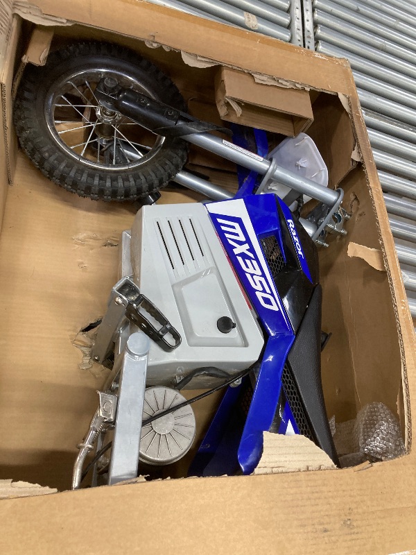 Photo 1 of ***MISSING CHARGER***Razor MX350 Dirt Rocket Electric Bike for Kids Ages 8+, 140 lb Max Weight, Blue – 24V Battery, Up to 14 Mph, 30-Min Ride Time on High Speed, Twist-Grip Throttle, Spoked Wheels w/ 12” Pneumatic Tires***MISSING CHARGER***