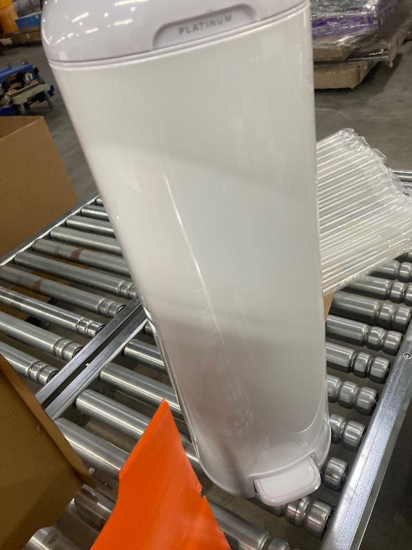 Photo 1 of ***DAMAGE, SOME DENTS ON SIDE, SELLINGH AS IS*** Diaper Genie Platinum Pail (Lily White) is Made in Durable Stainless Steel and Includes 1 Easy Roll Refill with 18 Bags That can Last up to 5 Months. ***DAMAGE, SOME DENTS ON SIDE, SELLINGH AS IS***
