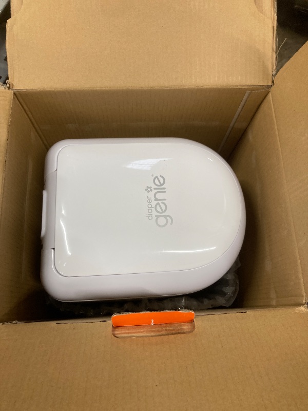 Photo 1 of ***DAMAGE, SOME DENTS ON SIDE, SELLINGH AS IS*** Diaper Genie Platinum Pail (Lily White) is Made in Durable Stainless Steel and Includes 1 Easy Roll Refill with 18 Bags That can Last up to 5 Months. ***DAMAGE, SOME DENTS ON SIDE, SELLINGH AS IS***