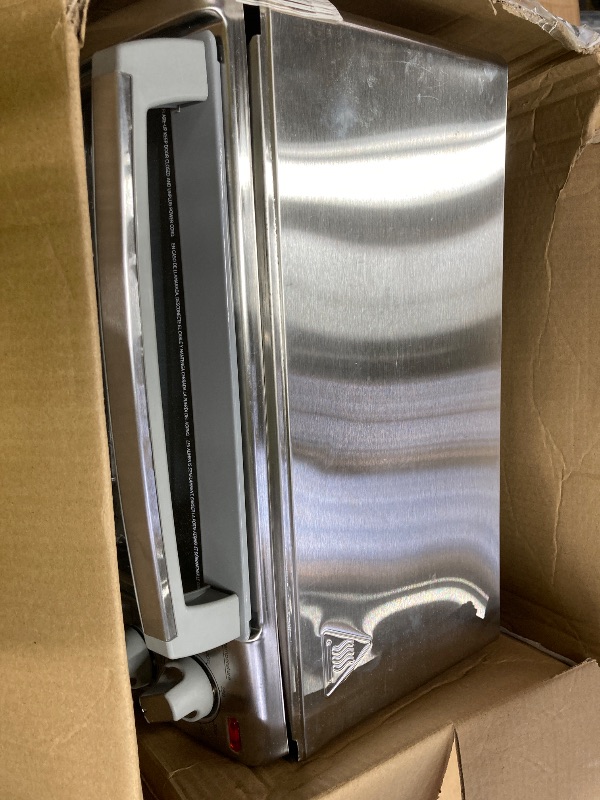Photo 1 of **HAS DENTS AND DOOR HANDLE IS BROKEN**BLACK+DECKER 4-Slice Toaster Oven with Natural Convection, Stainless Steel, TO1760SS (TO1760SST-1)