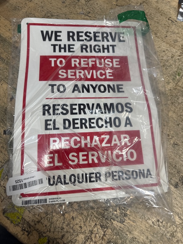 Photo 1 of "We Reserve The Right to Refuse Service to Anyone" Bilingual Sign by SmartSign | 10" x 14" Plastic