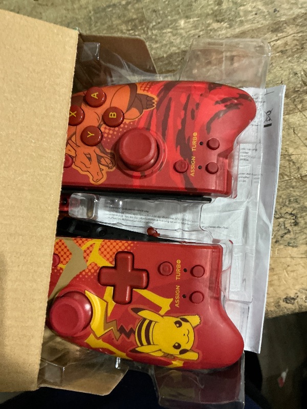 Photo 1 of ***MINOR DAMAGE (LEFT JOYSTICK DAMAGED) *** Nintendo Switch Split Pad Pro (Pikachu & Charizard) - Ergonomic Controller for Handheld Mode - Officially Licensed by Nintendo & Pokémon