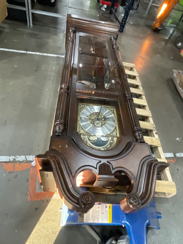 Photo 1 of ***1 BROKEN MIRROR AND MISSING KEY***Howard Miller Vuchinich Grandfather Clock II, Wood Finish with Triple Chime Movement Floor Clocks, Swan-Neck Pediment Perfect for Home Decor, Living Room & Office Heirloom Modern Timepiece