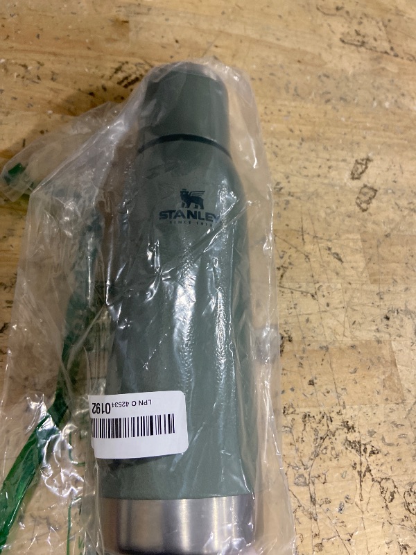 Photo 1 of ***HAS WATER RESIDUE ON INSIDE*** Stanley Adventure-To-Go Vacuum Bottle 25 oz | Wide Mouth with Leakproof Cup Lid | Keep Drinks Hot or Cold | Packable for Travel | Insulated Stainless Steel Thermal Bottle | BPA-Free | Hammertone Green