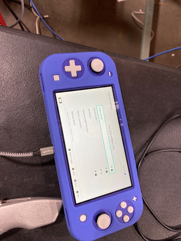 Photo 1 of Nintendo Switch Lite - Blue 
(Charging adapter not included only charging chord)