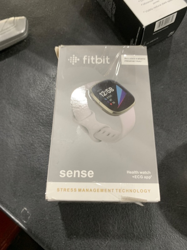 Photo 1 of Fitbit Sense Advanced Smartwatch with Tools for Heart Health, Stress Management & Skin Temperature Trends, White/Gold, One Size (S & L Bands Included)