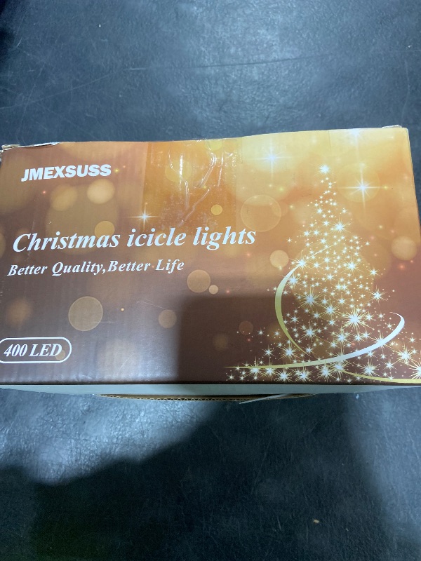 Photo 1 of JMEXSUSS 38.8FT Icicle Lights for Outside, 400 LED Icicle Christmas Lights Outdoor Indoor Plug in, Warm White String Lights for Christmas House Patio Party Fireplace Holiday Decorations