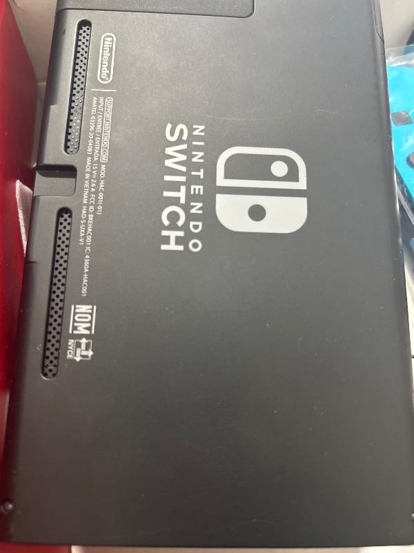 Photo 1 of Nintendo Switch with Neon Blue and Neon Red Joy-Con - Handheld Gaming Console
