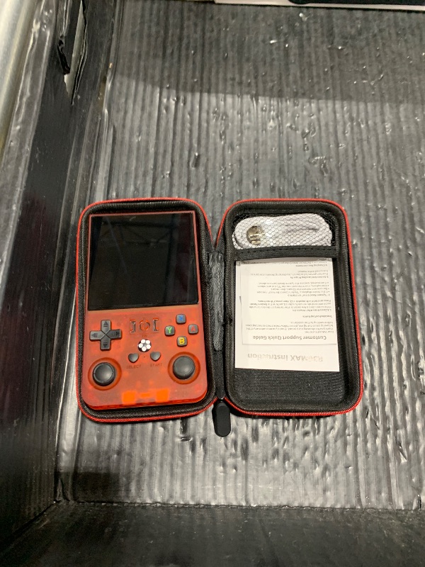 Photo 1 of R36MAX Handheld Game Console, Retro Gaming Console with 4000mAh Battery 4.0”IPS Screen, Open Source Linux System, with 64GB TF Card Portable Video Gaming Console, Transparent Ruby