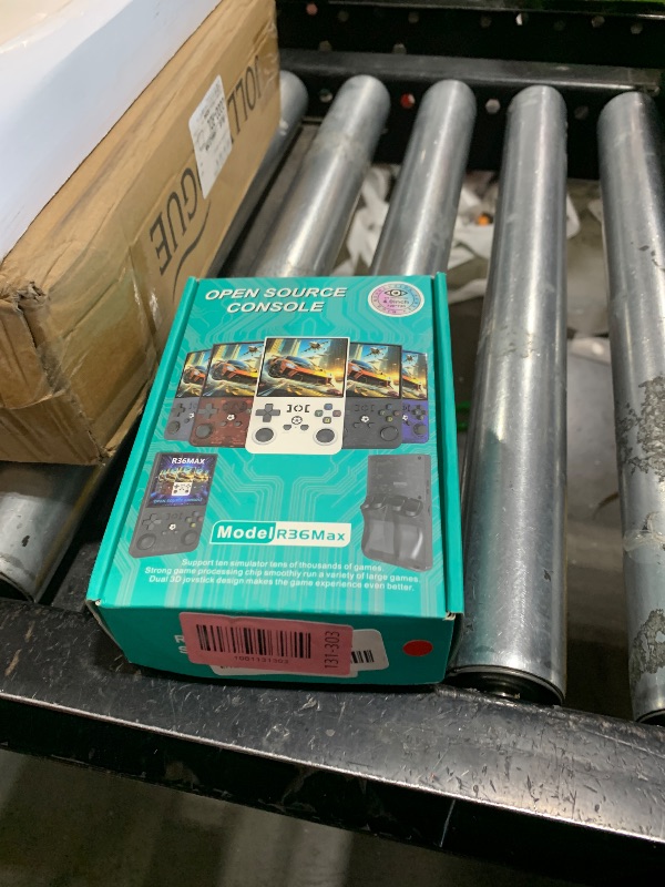 Photo 1 of R36MAX Handheld Game Console, Retro Gaming Console with 4000mAh Battery 4.0”IPS Screen, Open Source Linux System, with 64GB TF Card Portable Video Gaming Console, Transparent Ruby