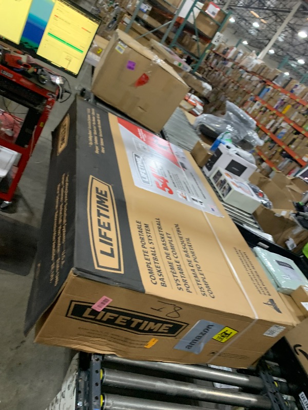 Photo 1 of Lifetime Portable Basketball Hoop, 54 Inch Steel-Framed Acrylic Backboard