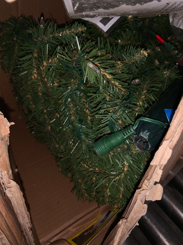 Photo 1 of National Tree Company 7.5 ft Pre-Lit Dunhill Fir Artificial Christmas Tree, 700 LED Lights, 2,514 Tips, Foot Pedal, 10 Light Functions, Includes Stand, Green