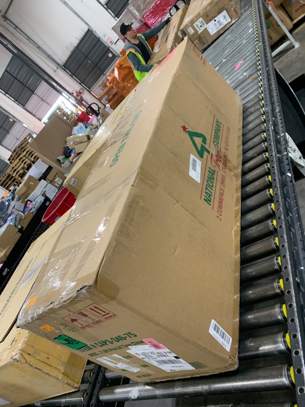 Photo 1 of National Tree Company 7.5 ft Pre-Lit Carolina Pine Artificial Christmas Tree, 1,000 Clear Lights, 1,399 Tips, Includes Stand, Green