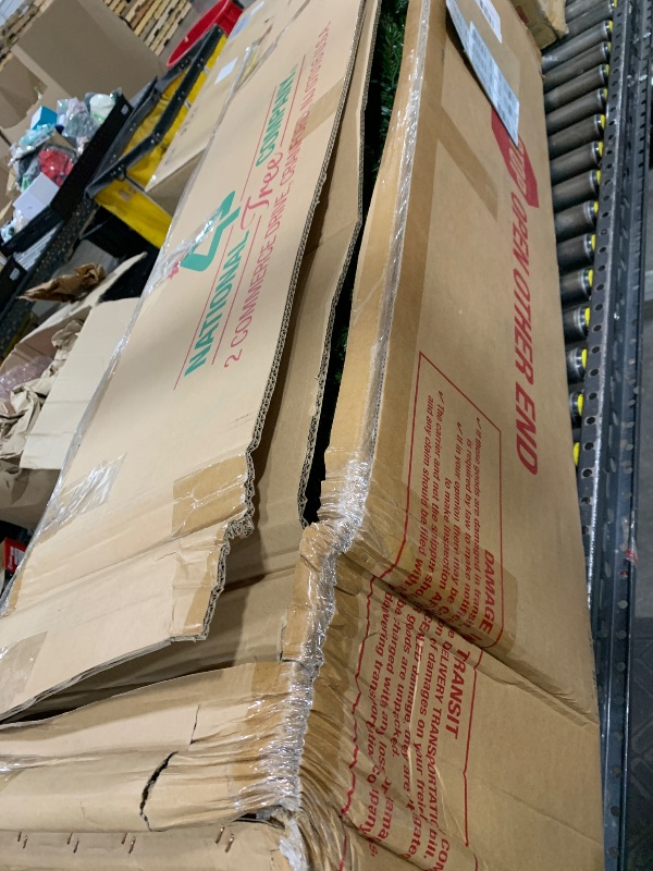 Photo 1 of National Tree Company Pre-Lit Artificial Full Christmas Tree, Green, Dunhill Fir, White Lights, Includes Stand, 9 Feet