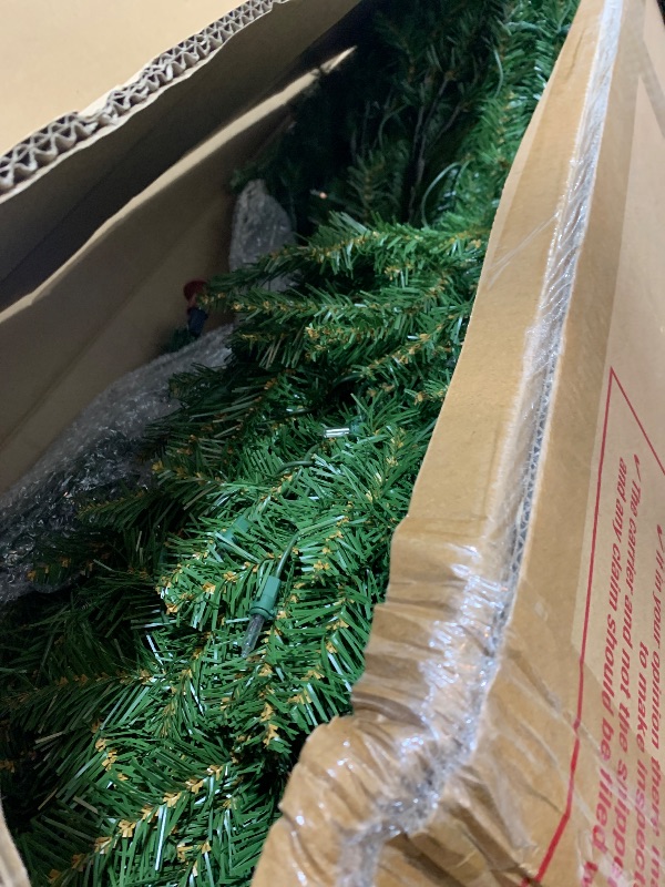 Photo 1 of National Tree Company Pre-Lit Artificial Full Christmas Tree, Green, Dunhill Fir, White Lights, Includes Stand, 9 Feet