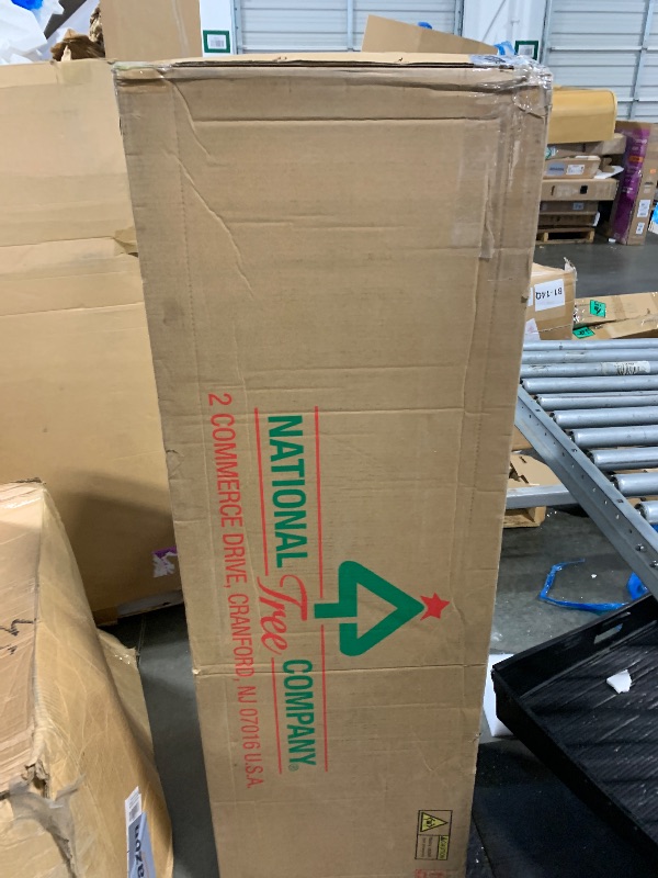 Photo 1 of ** USED/ UNTESTEDNational Tree Company 7.5 ft Pre-Lit Carolina Pine Artificial Christmas Tree, 750 Clear Lights, 1,399 Tips, Includes Stand, Green