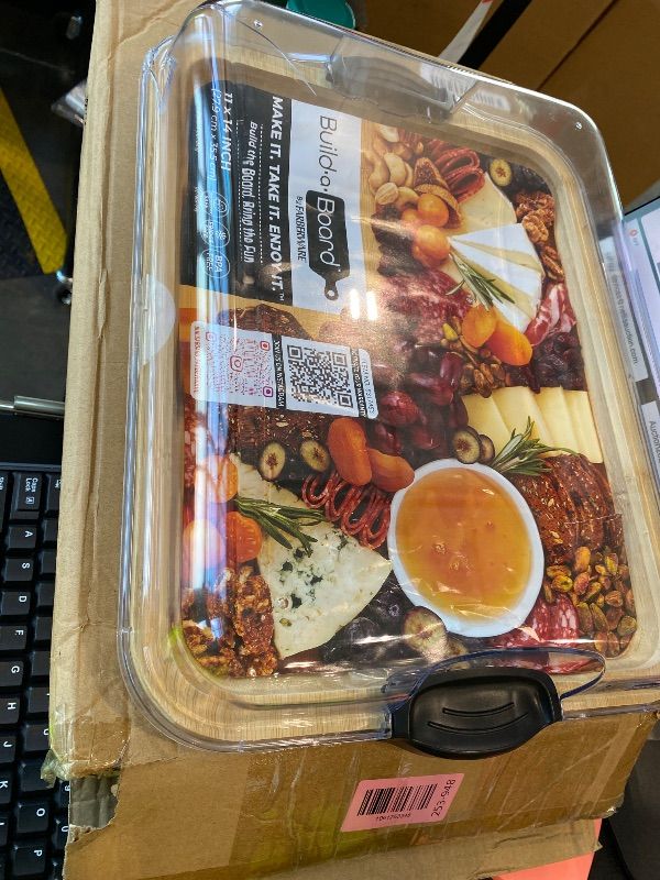 Photo 1 of *MINOR DAMAGE - USED*
Farberware Build-A-Board Bamboo Cutting Board with Single Storage Compartment, Clear Locking Lid, Black Handles, Perfect for Charcuterie & Snacks