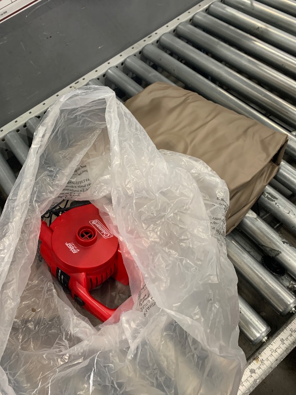 Photo 1 of ************HAS A SMALL HOLE THAT NEEDS PATCHING*************
brown air mattress with red air pump