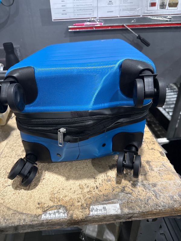 Photo 1 of ***BOTTOM IS DAMAGED***Amazon Basics 21" Hardside Carry-On Luggage, Hardshell Suitcase With Wheels, Expandable For Up to 25% More Space, With Scratch-Resistant Surface, Four Multi-directional Wheels, Light Blue