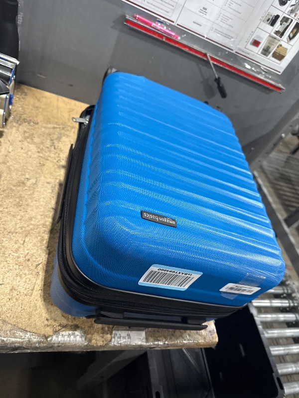 Photo 1 of ***BOTTOM IS DAMAGED***Amazon Basics 21" Hardside Carry-On Luggage, Hardshell Suitcase With Wheels, Expandable For Up to 25% More Space, With Scratch-Resistant Surface, Four Multi-directional Wheels, Light Blue