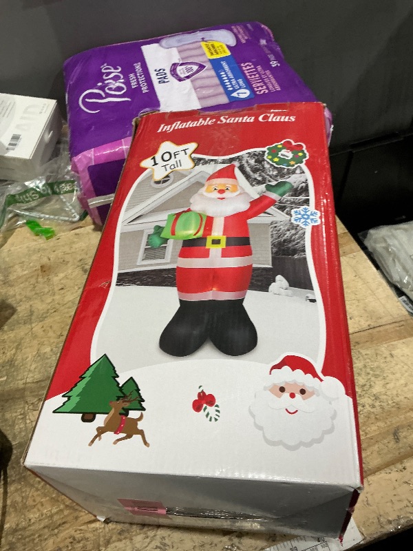 Photo 1 of 10 FT Christmas Inflatable Santa Claus Outdoor Decorations, Blow Up Santa Claus Holding Gift Box for Xmas Outside Decor, Giant Santa with Bright LED Lights for Yard Patio Garden Lawn Holiday Party