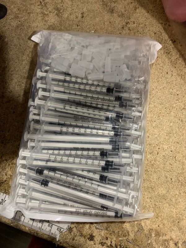 Photo 1 of 100 Pack 1ml Syringe with Cap for Liquid, 1cc Plastic Small Syringes with Cover, Non-Sterile, No Needle