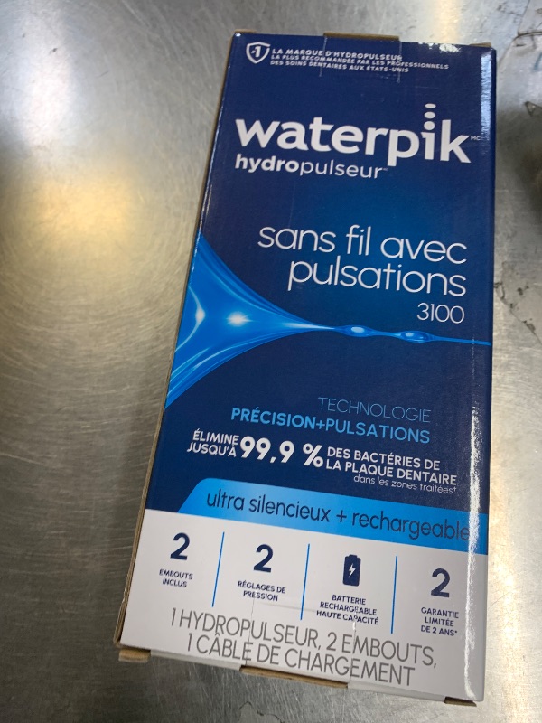 Photo 1 of Waterpik Cordless Pulse Rechargeable Portable Water Flosser for Teeth, Gums, Braces Care and Travel with 2 Flossing Tips, Waterproof for Shower, ADA Accepted, WF-20 White, Packaging and Tips May Vary
