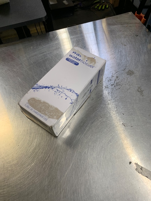 Photo 1 of **USED** Waterpik Cordless Pulse Rechargeable Portable Water Flosser for Teeth, Gums, Braces Care and Travel with 2 Flossing Tips, Waterproof, ADA Accepted, WF-20 Gray, Packaging May Vary