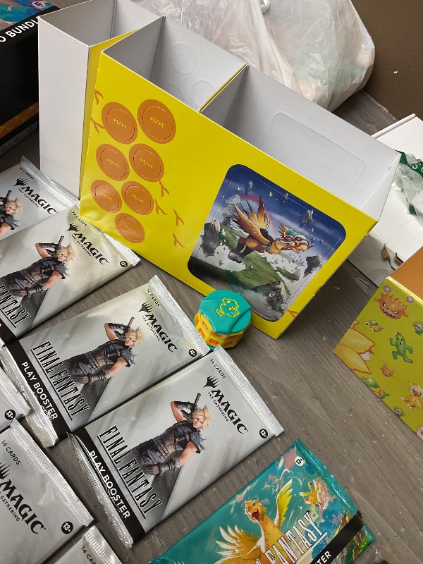Photo 1 of Magic: The Gathering - Final Fantasy Chocobo Bundle (1 Chocobo Booster, 10 Play Boosters, 1 Alt-Art Promo Card, 1 Scene Card, 32 Basic Lands, 1 Click Wheel, and More)