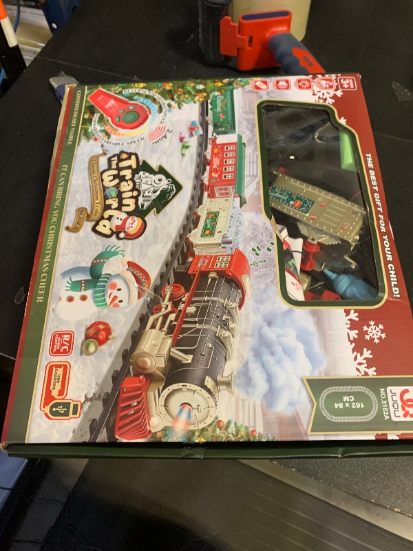 Photo 1 of JQ JUQU Remote Control Train Set for Kids Ages 3-8 with Steam, Lights and Sounds, Electric Toy Train with 4 Cars and Tracks for Indoor Play and Holiday Decor