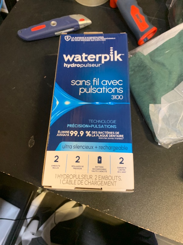 Photo 1 of Waterpik Cordless Pulse Rechargeable Portable Water Flosser for Teeth, Gums, Braces Care and Travel with 2 Flossing Tips, Waterproof for Shower Use, ADA Accepted, WF-20 Pink, Packaging May Vary