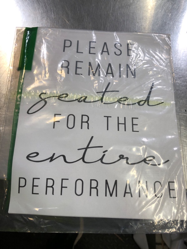 Photo 1 of "please remain seated for the entire performance" sign