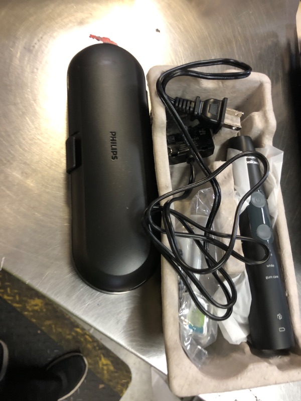 Photo 1 of Philips Sonicare ProtectiveClean 5300 Rechargeable Electric Toothbrush, with Pressure Sensor, 3 Cleaning Modes, SmarTimer and QuadPacer, with 2 Bonus Brush Heads, Travel Case, Black, Model HX6423/34