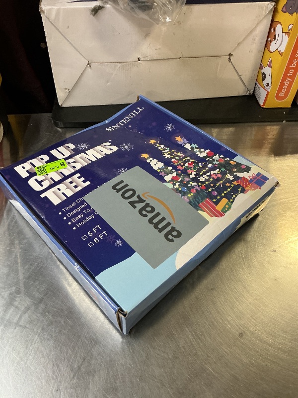 Photo 1 of SINTENILL 5 FT Pop Up Christmas Tree with Timer Lights and Decorations, Green Tinsel Artificial Christmas Tree with 24 Balls Ornaments, Collapsible Pencil Tree for Xmas Home Office Party Decor