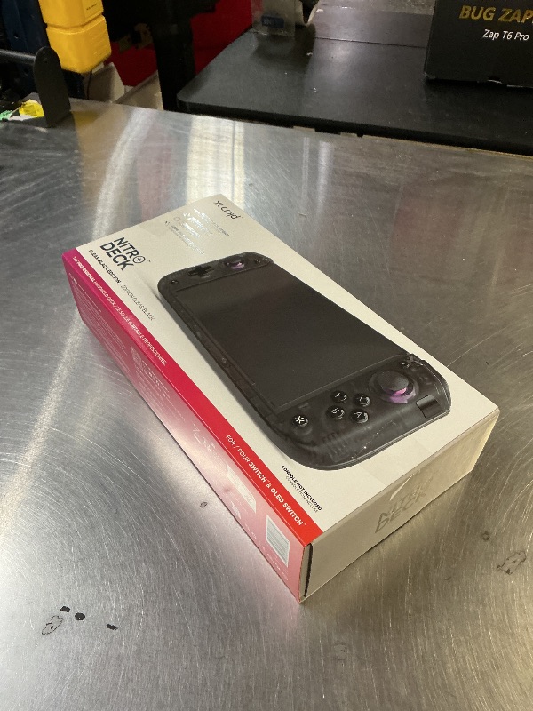 Photo 1 of CRKD Nitro Deck+ with HDMI Adapter - Handheld Pro Controller for Nintendo Switch & OLED Model - TV Dockable - Programmable Sidekicks & Back Buttons - True Collection System (Clear Black Edition)