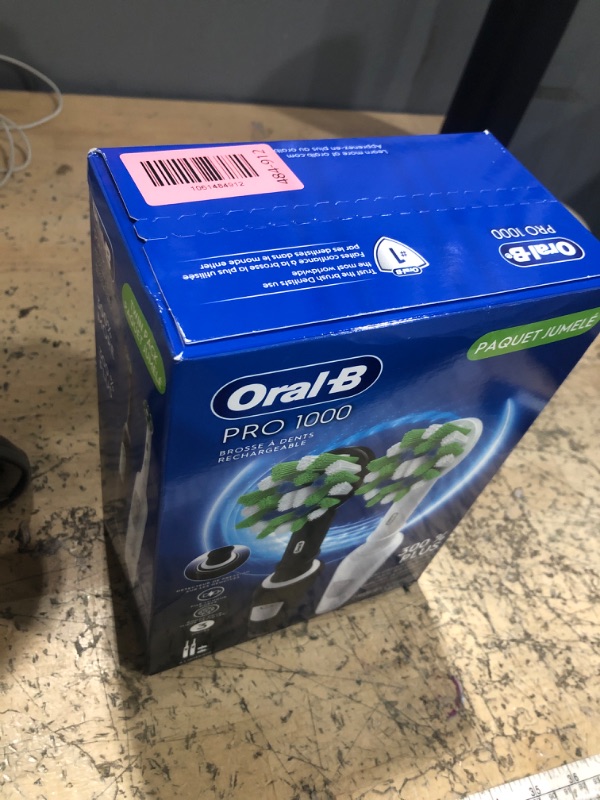 Photo 1 of **FACTORY SEALED**Oral-B Pro 1000 CrossAction Electric Toothbrush, Black and White, 2 Count