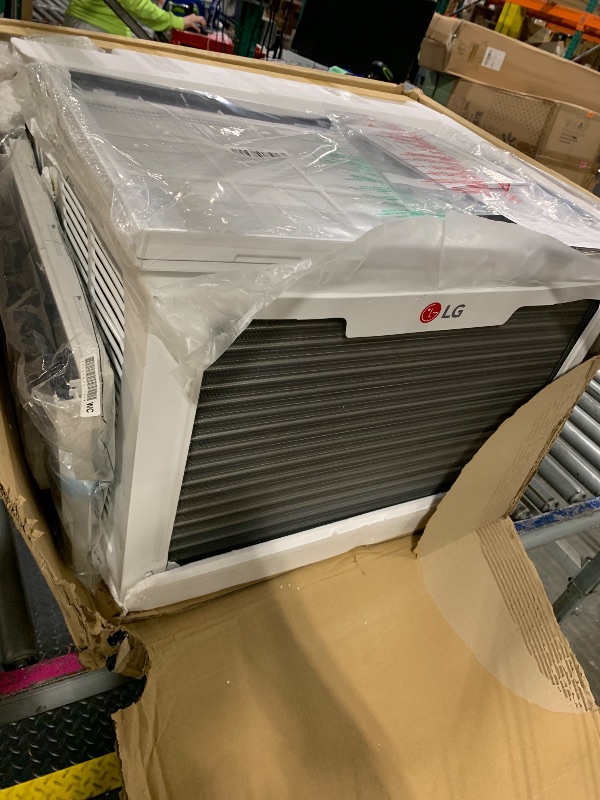 Photo 1 of ** *USED/ UNTESTED/ MANUAL INCLUDED*** LG 12,200 BTU Window Air Conditioner with Supplemental Heat, 230/208V, Cools 570 Sq.Ft. (19' x 30' Room Size), Electronic Controls with Remote, 2 Cooling, Heating & Fan Speeds, Slide In-Out Chassis