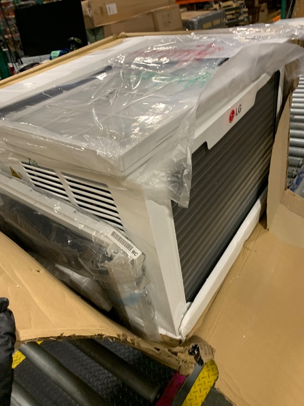 Photo 1 of ** *USED/ UNTESTED/ MANUAL INCLUDED*** LG 12,200 BTU Window Air Conditioner with Supplemental Heat, 230/208V, Cools 570 Sq.Ft. (19' x 30' Room Size), Electronic Controls with Remote, 2 Cooling, Heating & Fan Speeds, Slide In-Out Chassis