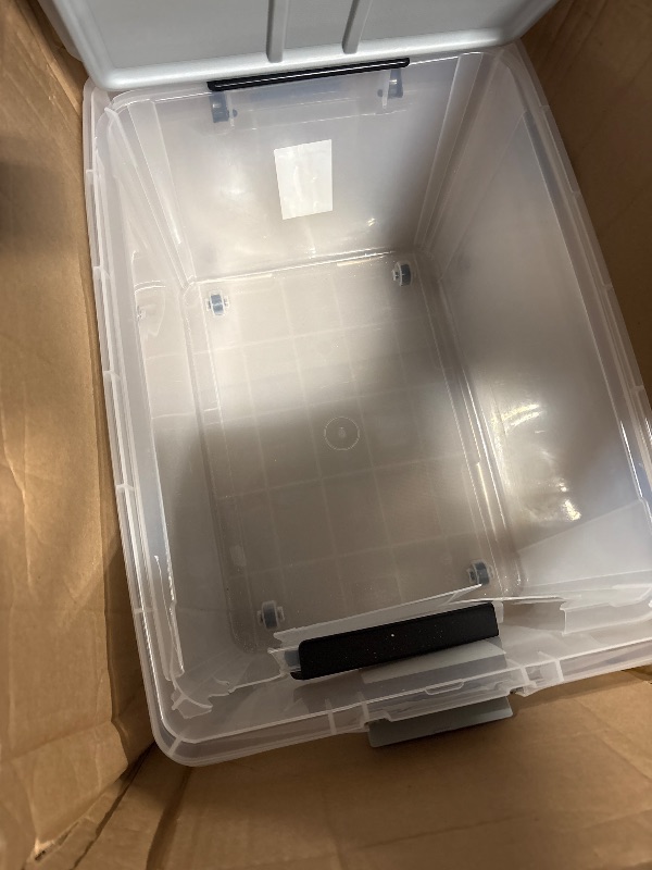 Photo 1 of **DAMAGED**
Rubbermaid Roughneck Clear 66 Qt/16.5 Gal Storage Containers, Pack of 4 with Latching Grey Lids, Visible Base, Sturdy and Stackable, Great for Storage and Organization