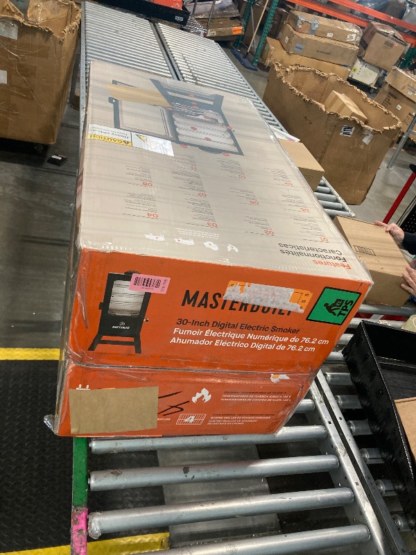 Photo 1 of   ** MINOR DENT ON TOP OF DOOR *** Masterbuilt® 30-inch Digital Electric Vertical BBQ Smoker with Leg Kit, Side Wood Chip Loader and 710 Cooking Square Inches in Black, Model MB20070421