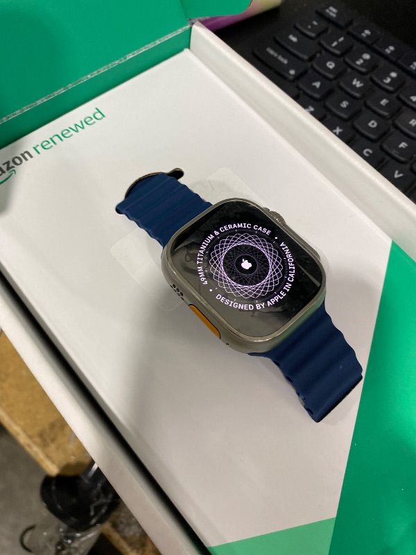 Photo 1 of Apple Watch Ultra 2 [GPS + Cellular, 49mm] - Titanium Case with Blue Ocean Band, One Size (Renewed Premium)