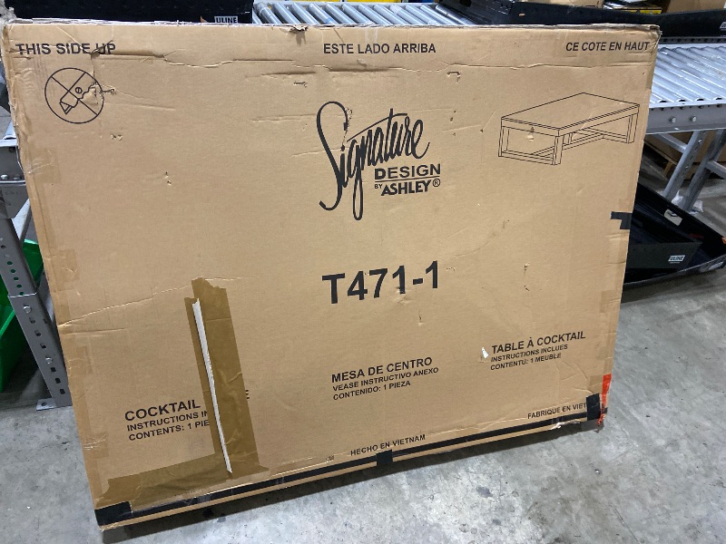 Photo 1 of Signature Design by Ashley Cariton Contemporary Rectangular Cocktail Table, Brown