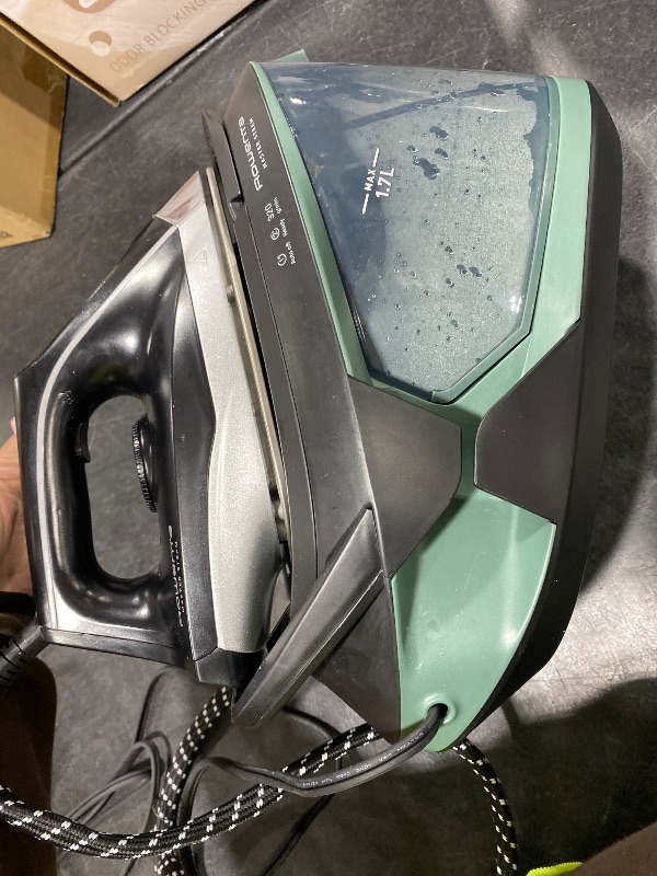 Photo 1 of Rowenta Iron Steamer for Clothes Master Steam Station, Professional Steam Iron for Clothes with Stainless Steel Soleplate, 57 Oz, 400 Microsteam Holes, Built-In Pump, 1750 Watts, Black/Green, VR8338
