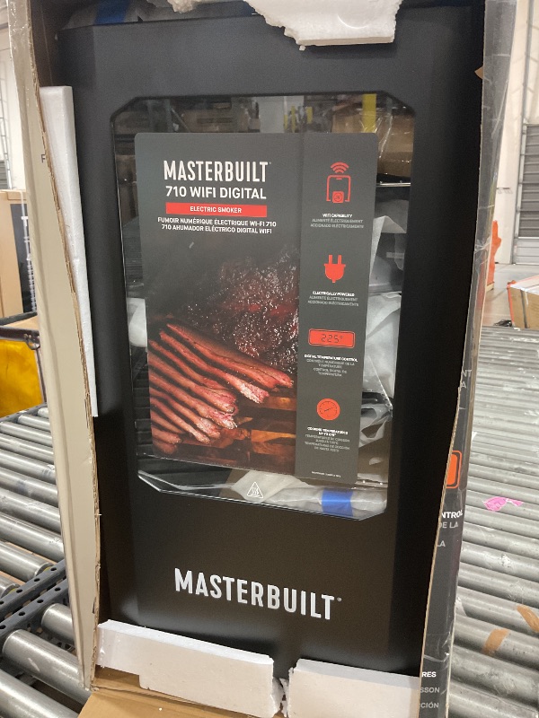 Photo 1 of Masterbuilt®710 WiFi Digital Smoker, Vertical Design, 711 Cooking Sq. Inches, 4 Chrome Coated Smoking Racks, Wood Chip Loader, Electric Fuel Source to Plug in and Start Cooking, Black Model MB20070924