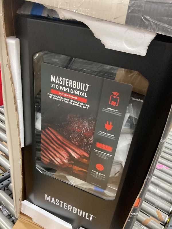 Photo 1 of Masterbuilt®710 WiFi Digital Smoker, Vertical Design, 711 Cooking Sq. Inches, 4 Chrome Coated Smoking Racks, Wood Chip Loader, Electric Fuel Source to Plug in and Start Cooking, Black Model MB20070924